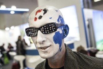 DEU Germany Germany Berlin International Tourism Exchange ITB. A man with a painted head, on which