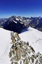 View from the Aiguille du Midi mountain station observation deck of the mountains Aiguille Vert,