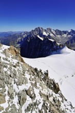 View from the Aiguille du Midi mountain station observation deck of the mountains Aiguille Vert,
