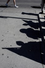 DEU Germany Germany Berlin tourists at Checkpoint Charlie. Shadows of extras disguised as soldiers