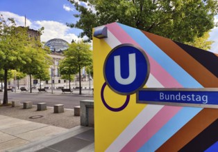 Entrance to Bundestag subway station with Reichstag in the background, government district,