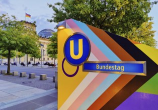 Entrance to Bundestag subway station with Reichstag in the background, government district,