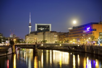 The river Spree in the government district with a full moon, the ARD capital studio and the Berlin