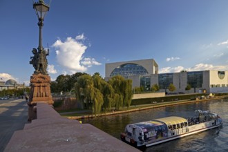 View of the Reichstag and the Federal Chancellery from the Moltke Bridge with an excursion boat on