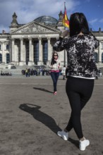 DEU Germany Germany Berlin Kazakh tourists take pictures of themselves in front of the Reichstag