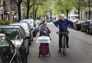 DEU Germany Germany Berlin Neighborhood conversation between an elderly woman with shopping cart