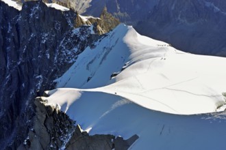 Snow-covered mountain ridge, Aiguille du Midi mountain station viewing platform,