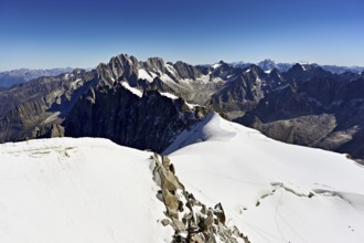 View from the Aiguille du Midi mountain station observation deck of the mountains Aiguille Vert,