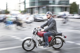 DEU Germany Germany Berlin Two-wheeled cyclists on a Simpson, an East German motorcycle company,