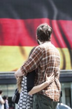 DEU Germany Germany Berlin Passers-by in front of a projection screen on Kurfürstendamm, on which a