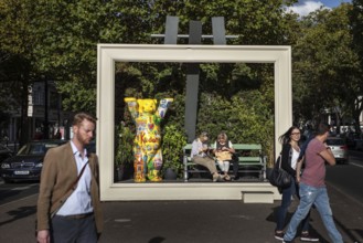 DEU Germany Germany Berlin Passers-by pass by an oversized picture frame with a Berlin bear on the