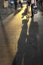 DEU Germany Germany Berlin Passers-by cast their shadow on Berlin's popular shopping street,