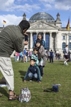 DEU Germany Germany Berlin Tourists take pictures of themselves in front of the Reichstag