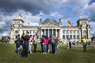 DEU Germany Germany Berlin Asian tourists take pictures of themselves in front of the Reichstag