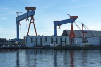 German Naval Yards, shipyard, warehouses, cranes, harbor, Baltic Sea, Kiel Fjord, shipping traffic,