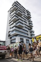 DEU Germany Germany Berlin Tourists pass through the opening in the East-Side Gallery, which was