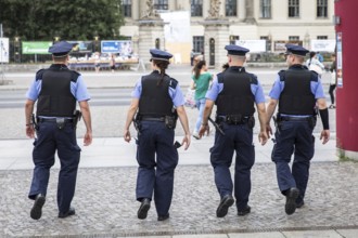 DEU Germany Germany Berlin Four policemen mesh across Bebelplatz