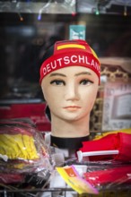 DEU Germany Germany Berlin doll with euro 2016 fan item in a shop window in Neukölln