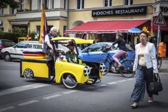 DEU Germany Germany Berlin A man drives through Schöneberg in a self-made European championship