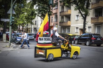 DEU Germany Germany Berlin A man drives through Schöneberg in a self-made European championship