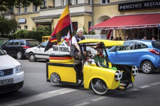 DEU Germany Germany Berlin A man drives through Schöneberg in a self-made European championship