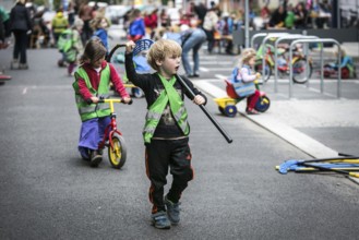 DEU Germany Germany Berlin Children play on Gudvanger Straße, which has been declared the city's