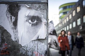 DEU Germany Germany Berlin poster with the eyes of a man's face on Rudi-Dutschke-Str