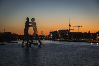 DEU Germany Germany Berlin View over Osthafen across the Spree towards Alex at sunset
