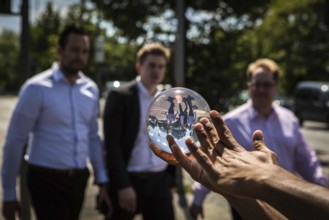 DEU Germany Germany Berlin Juggler with crystal ball works at the intersection opposite the CDU