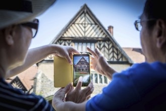 DEU Germany Germany Potsdam Tourists photograph the courtyard of the Cecilienhof with the Red Star