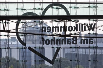 View from Central Station of the Reichstag dome with the inverted lettering Welcome to the Station