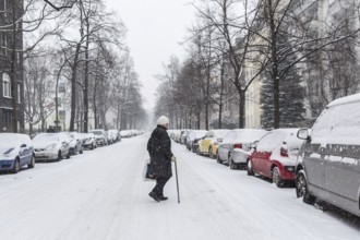 DEU Germany Germany Berlin Walking on snow-covered road in Schöneberg