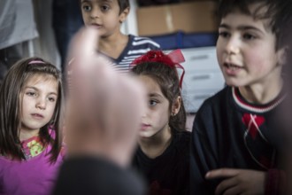 DEU Germany Germany Berlin An animation team entertains refugee children in an asylum center in