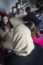 DEU Germany Germany Berlin An animation team entertains refugee children in an asylum center in