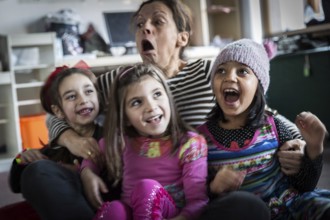 DEU Germany Germany Berlin An animation team entertains refugee children in an asylum center in