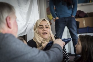DEU Germany Germany Berlin An animation team entertains refugee children in an asylum center in
