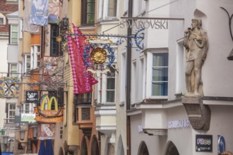 Golden roof, lots of people and historic houses in Herzog-Friedrich-Straße, Altstadt, Innsbruck,
