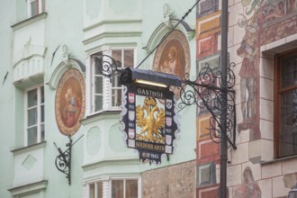 Old hanging sign from Gasthof Goldener Adler in Herzog-Friedrich-Straße, Old Town, Innsbruck,