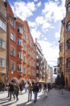 Many people and historic houses in Herzog-Friedrich-Straße, Altstadt, Innsbruck, Tyrol, Austria