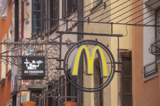 McDonald's hanging sign in Herzog-Friedrich-Straße, Altstadt, Innsbruck, Tyrol, Austria