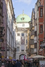Hofgasse with Hofburg Imperial Palace, historic houses and many people, old town, Innsbruck, Tyrol,