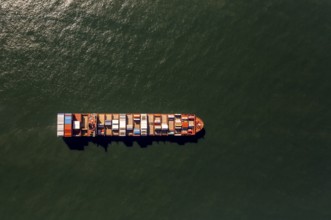 Container ship Maersk Lavras at anchor, aerial view, cargo ships at anchor off Spiekeroog, shipping