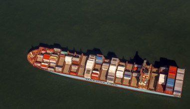 Container ship Maersk Lavras at anchor, aerial view, cargo ships at anchor off Spiekeroog, shipping