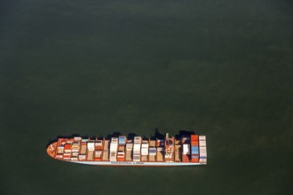 Container ship Maersk Lavras at anchor, aerial view, cargo ships at anchor off Spiekeroog, shipping