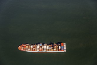 Container ship Maersk Lavras at anchor, aerial view, cargo ships at anchor off Spiekeroog, shipping