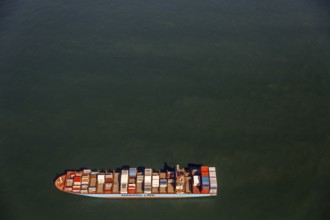 Container ship Maersk Lavras at anchor, aerial view, cargo ships at anchor off Spiekeroog, shipping