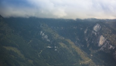 Motorised glider flying over the Alps, Salzburg, Alps, Austria, Europe, aerial view, birds-eyes