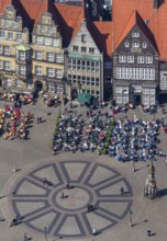Hanseatic cross in front of the Bremen Roland on the market square of Bremen in front of the town