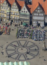 Hanseatic cross in front of the Bremen Roland on the market square of Bremen in front of the town