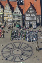 Hanseatic cross in front of the Bremen Roland on the market square of Bremen in front of the town